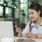 Businesswoman Engaging with Mobile Phone Technology. Digital Entrepreneurship.