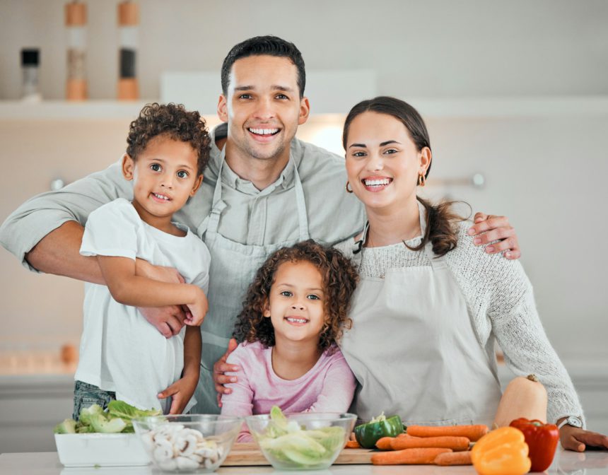 Cooking up a storm with the family. Shot of a young family cooking food at home.