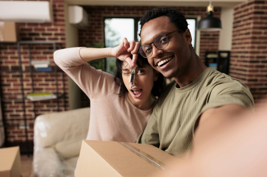 POV of diverse homeowners having house keys of rented flat